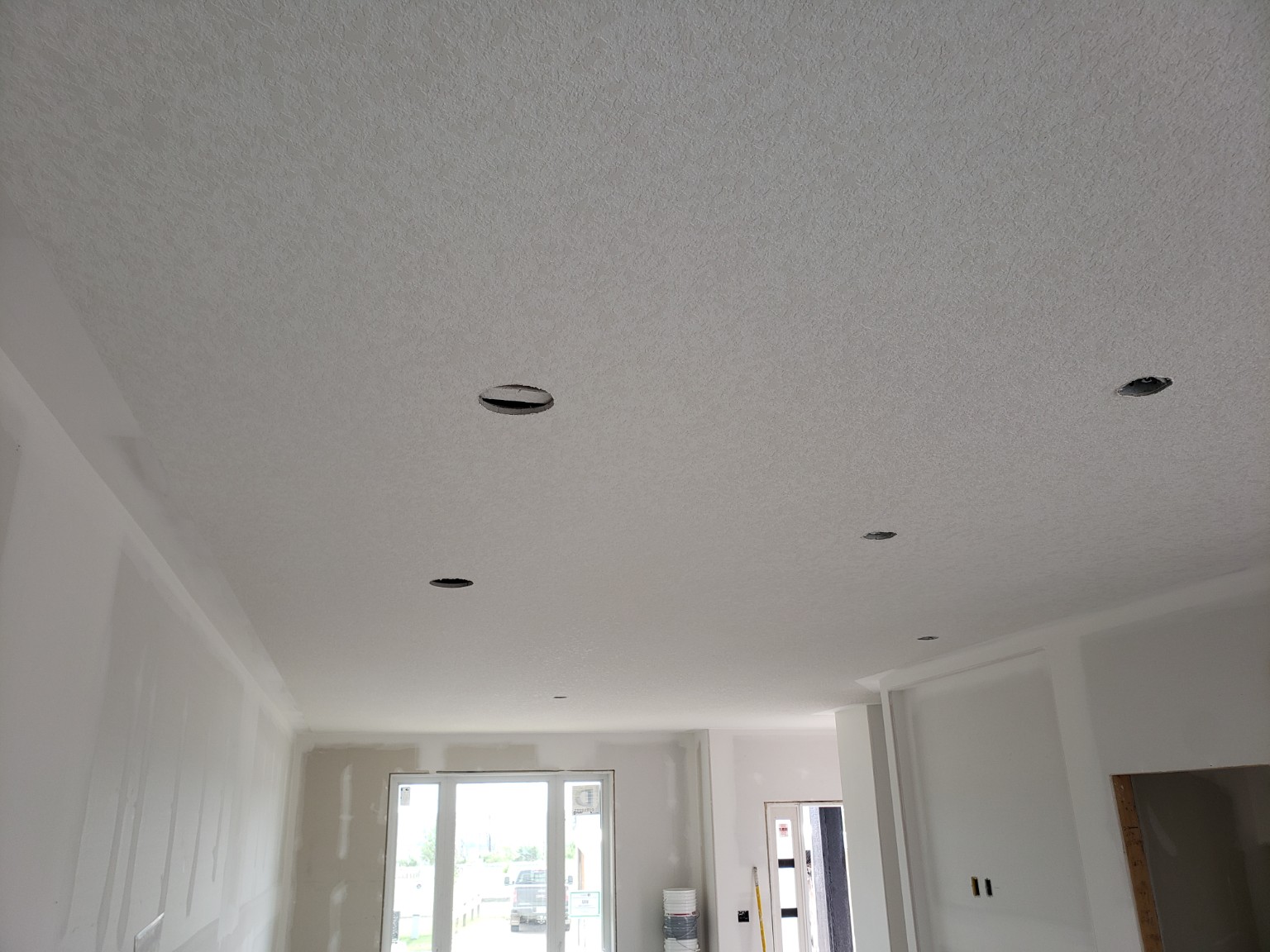 Consistent textured ceiling in a large open-concept home