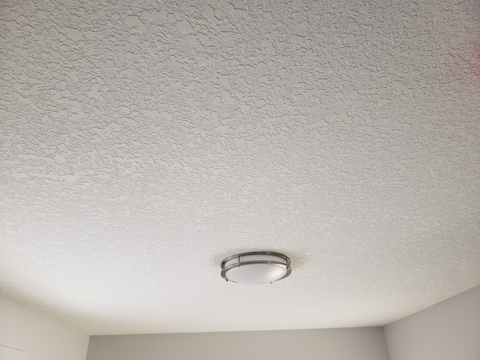 Close-up of completed white textured ceiling
